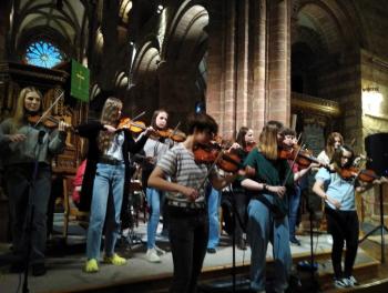 The group Young Eens play inside the Cathedral of St. Magnus, Orkney